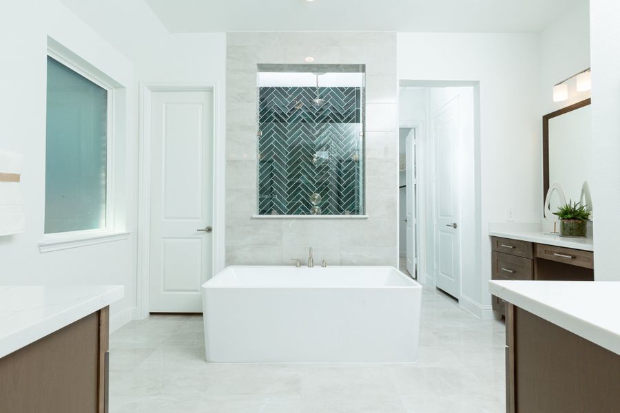 Furnished interior in a model home at ARTAVIA: Hilltop Collection in Conroe (Image 11).