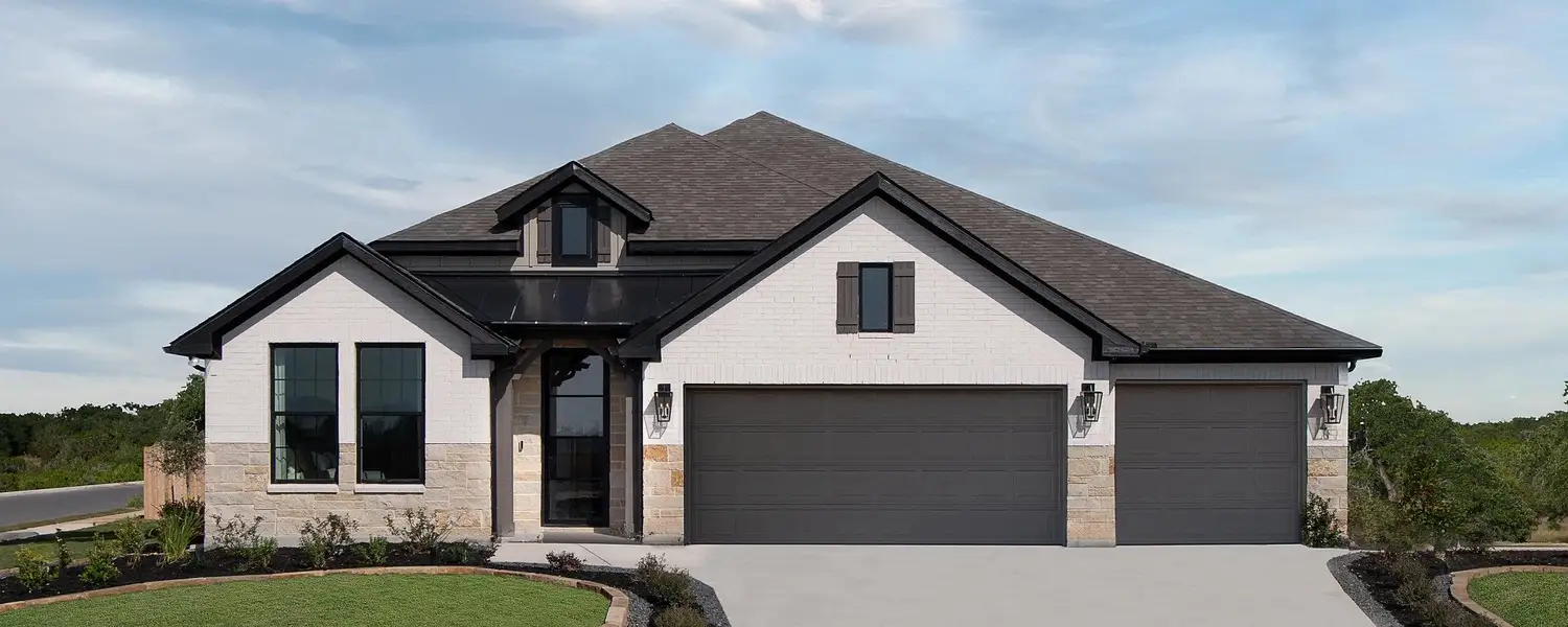 Front exterior of a home in the The Heritage at Saddlebrook Ranch 70's community, located in Schertz, TX (Image 1).