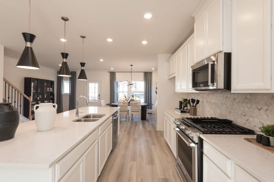 The spacious kitchen with a large island makes cooking a breeze.