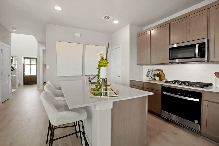 Kitchen in the Lakeside at Tessera Willow model home in Lago Vista TX by Trophy Signature Homes