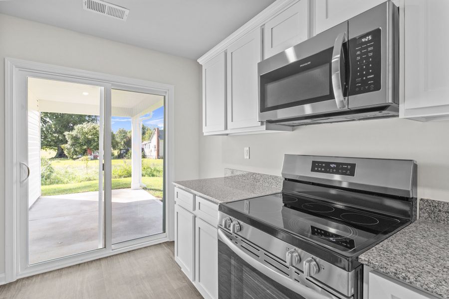Furnished interior in a model home at South Welcome in Greenville (Image 8).