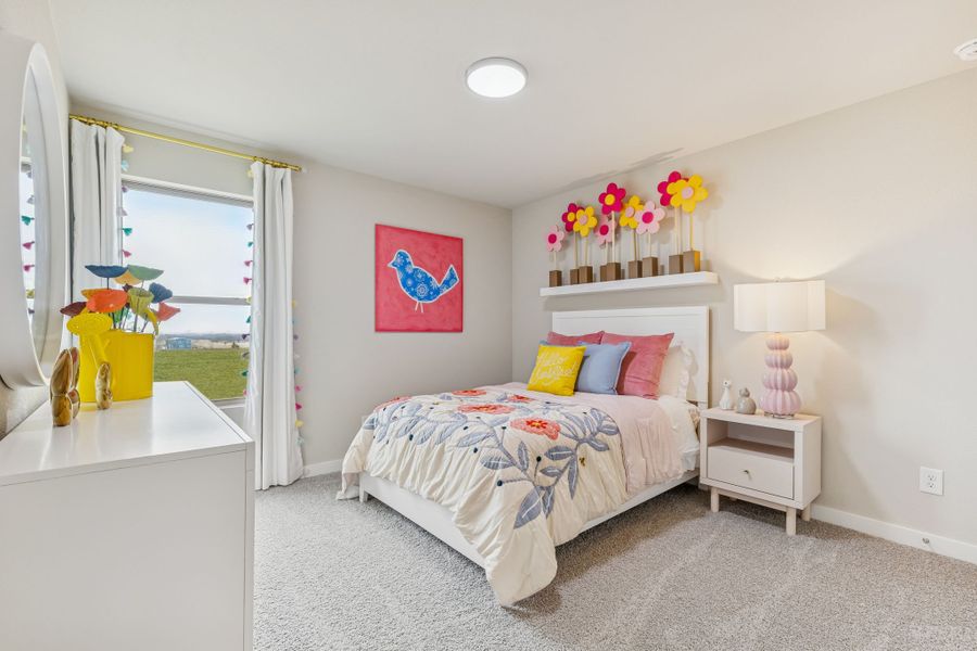 Bedroom in the Hayden home plan by Trophy Signature Homes - REPRESENTATIVE PHOTO