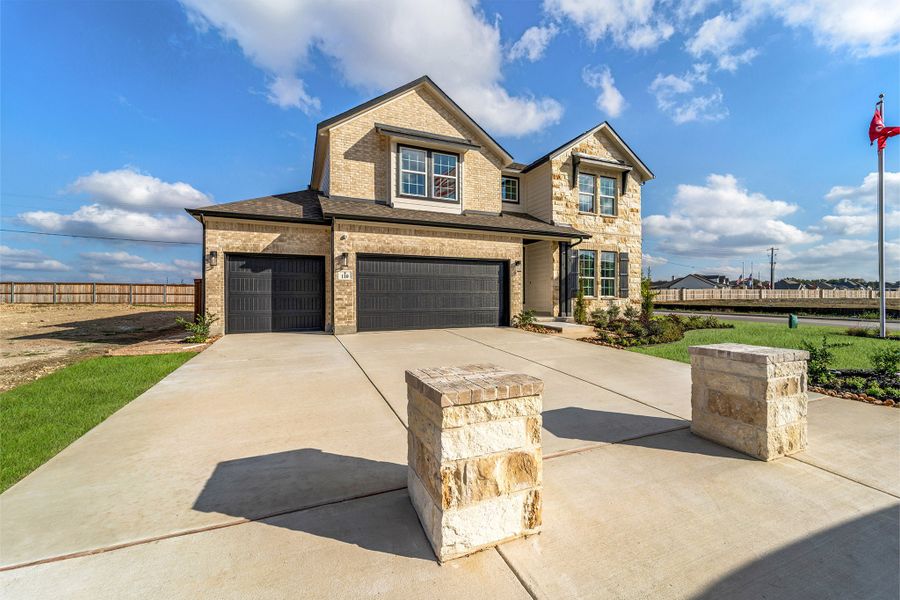 Front exterior of a home in the Megan's Landing community, located in Castroville, TX (Image 2). Front exterior of a home in the Megan's Landing community, located in Castroville, TX (Image 2).