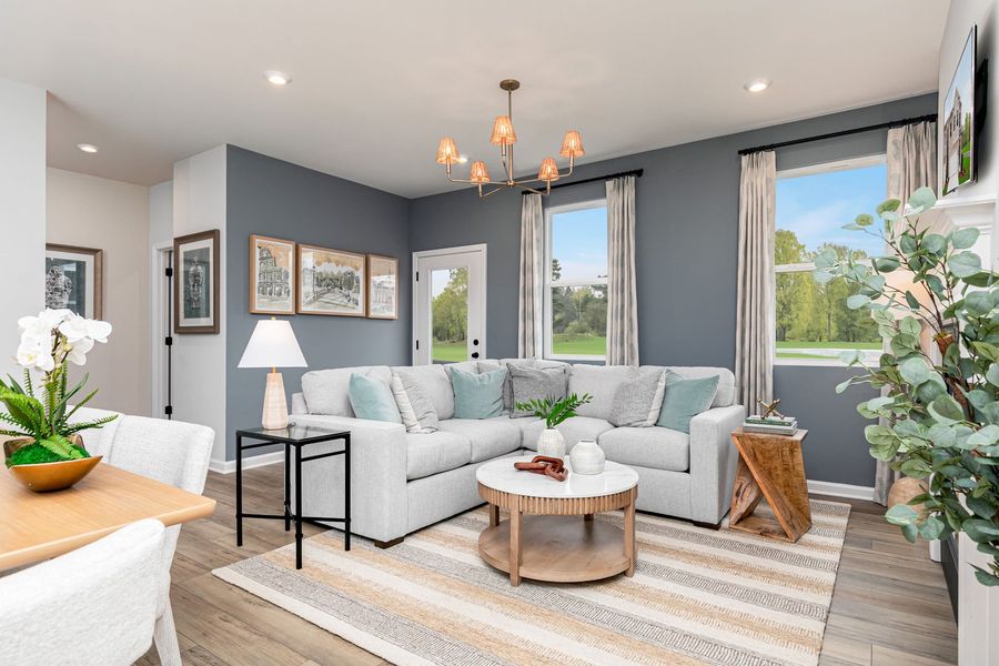 Spacious family room with a fireplace, perfect for relaxing and hosting friends and family