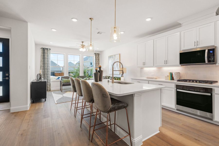 Furnished interior in a model home at Waterbend: Ivy Townhomes in Euless (Image 10).