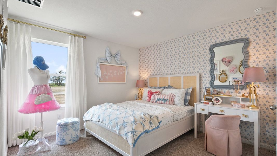 Furnished interior in a model home at Monarch Ranch in Manor (Image 28).