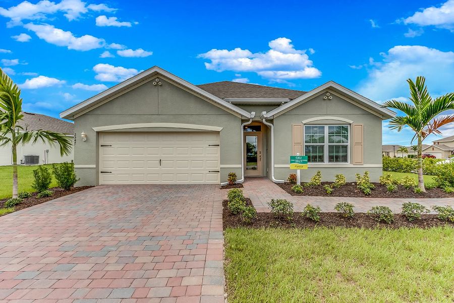 Front exterior of a home in the Burnt Store Village community, located in Punta Gorda, FL (Image 1).