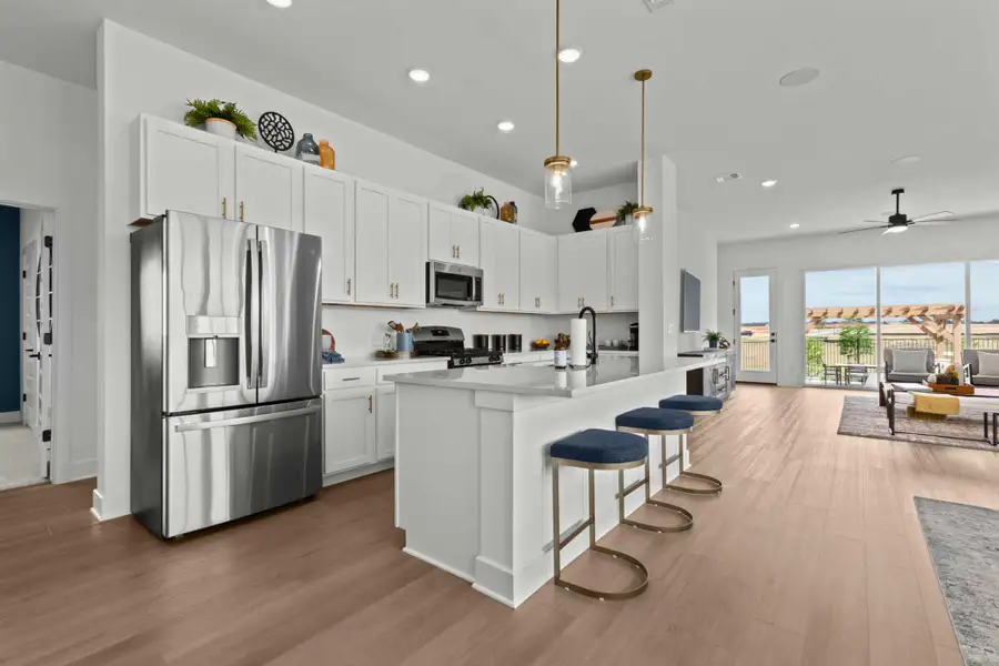 Furnished interior in a model home at Kissing Tree – Grove Series in San Marcos (Image 5).