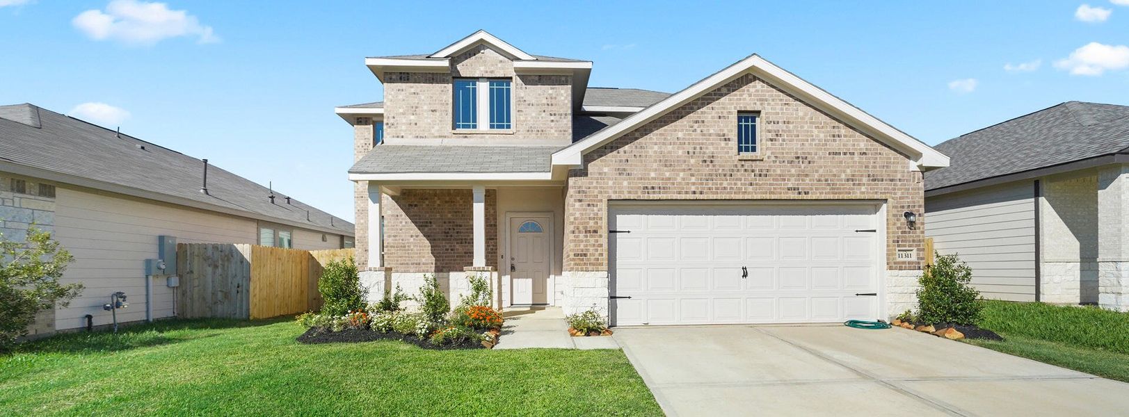 Front exterior of a home in the Clear View Estates community, located in Willis, TX (Image 9).