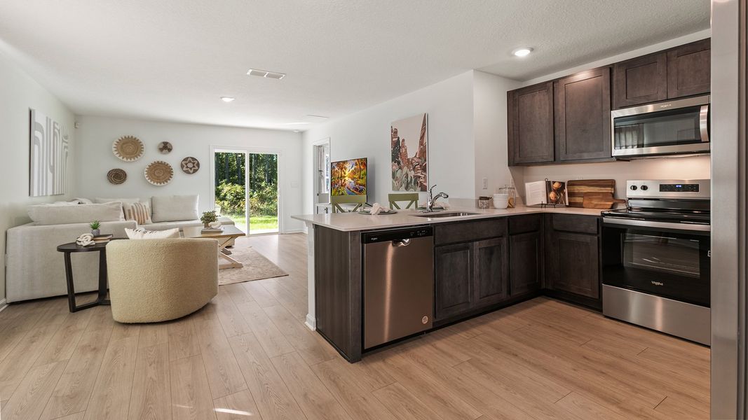 Furnished interior in a model home at Copes Landing in Jacksonville (Image 50).