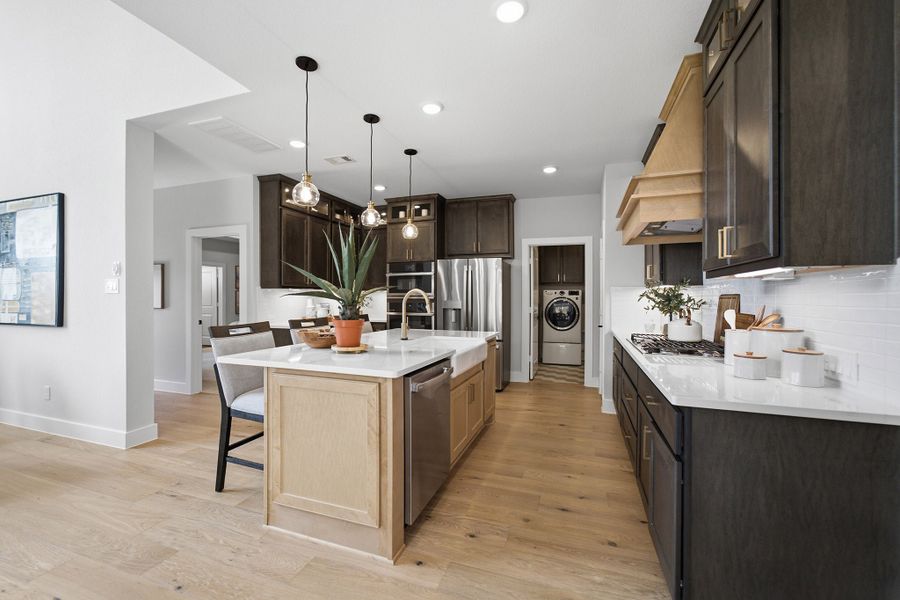 Furnished interior in a model home at Grand Magnolia in Waller (Image 24).