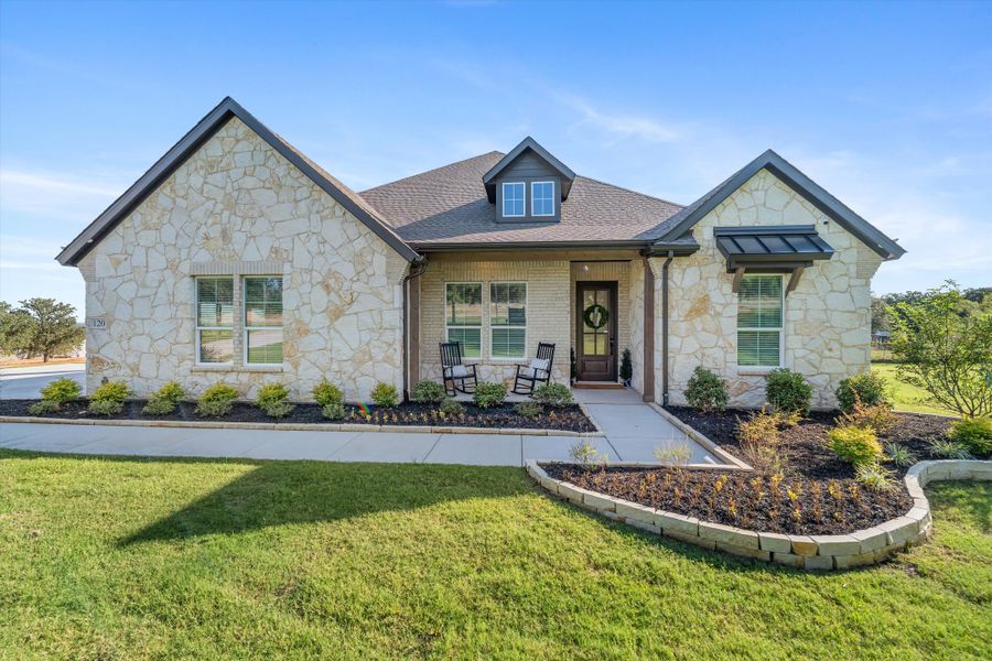 Front exterior of a home in the Oak Grove Addition community, located in Springtown, TX (Image 11).