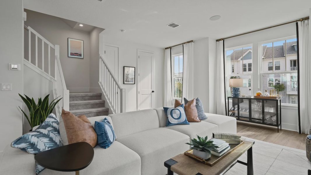 Modern comfort in the living room at Parkview at Hamlin with natural lighting and open floor space.