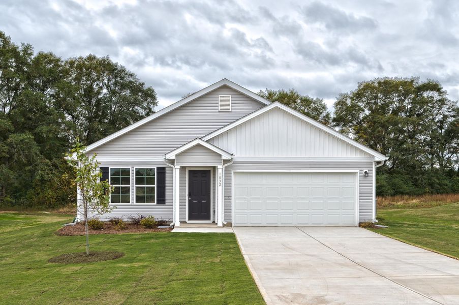 A white house with a garage.