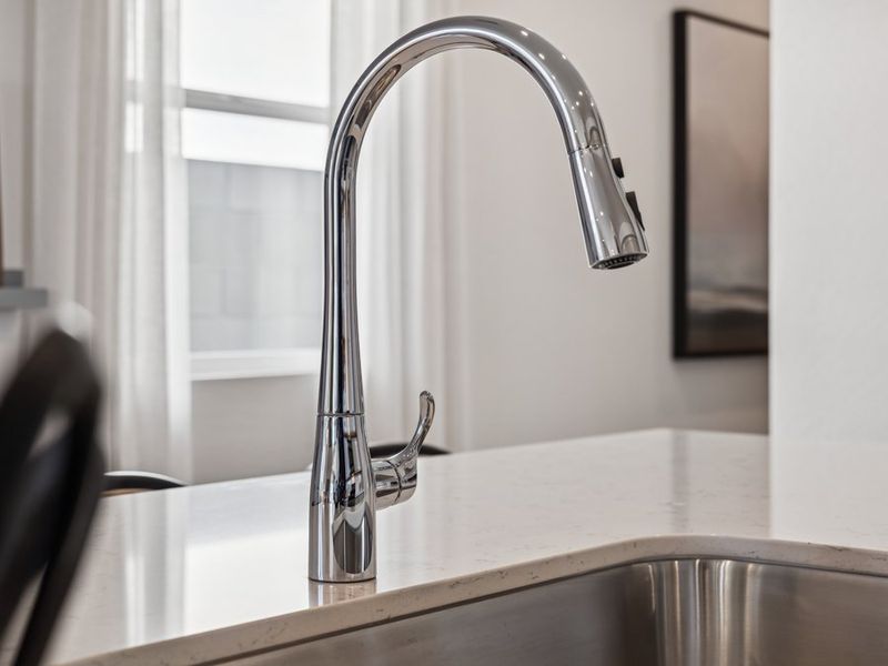 A faucet on a counter.