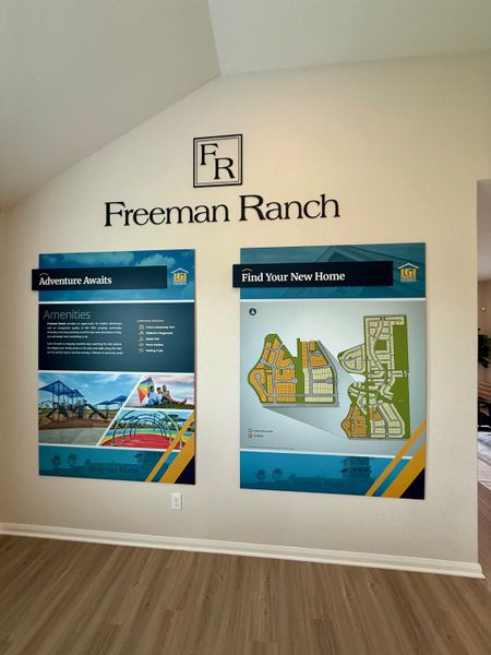 A welcoming info display with community maps and amenities at Freeman Ranch by LGI Homes (Katy, TX).