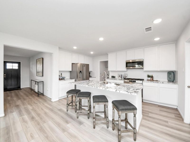 Furnished interior in a model home at Sunterra in Katy (Image 6).