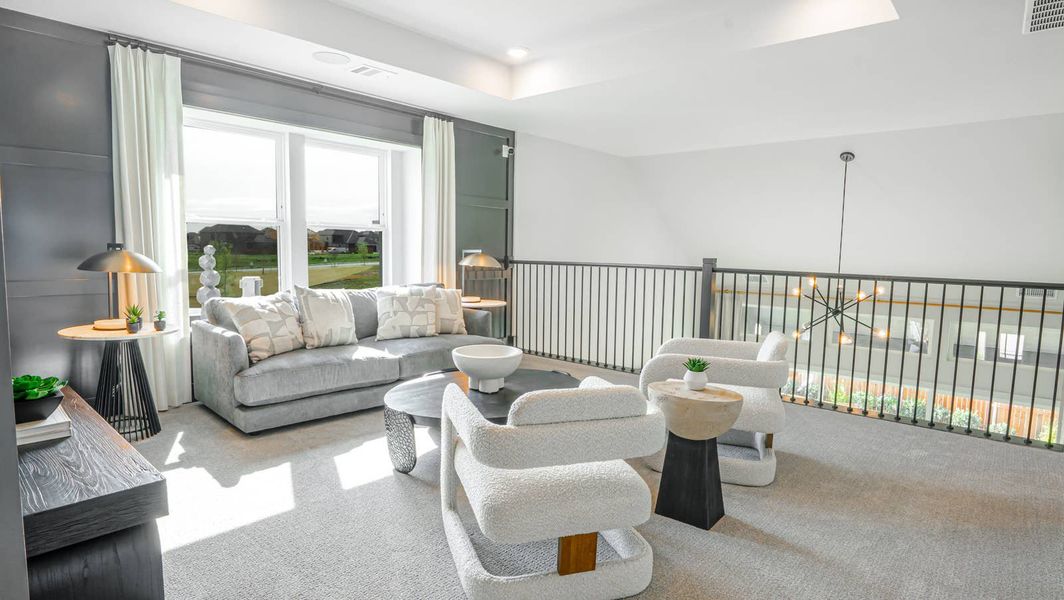 Furnished interior in a model home at Villages of Creekwood in Frisco (Image 8).