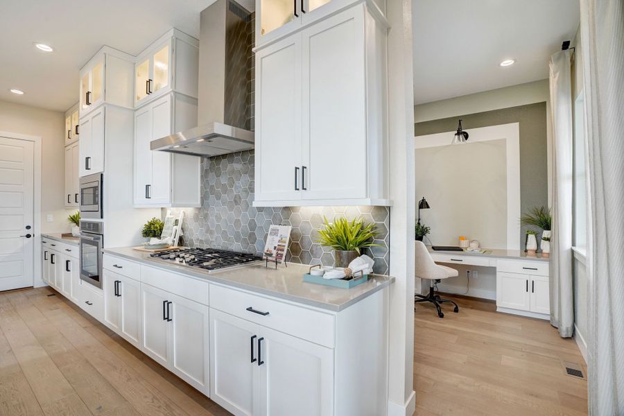 Furnished interior in a model home at Kitchel Lake at Serratoga Falls in Timnath (Image 40).