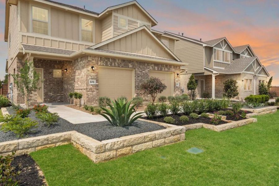 Front exterior of a home in the Saddle Creek Twinhomes community, located in Georgetown, TX (Image 6).