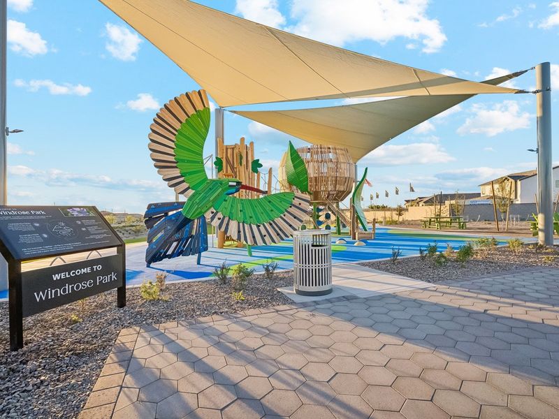 A large building with a large glass dome and a pool.