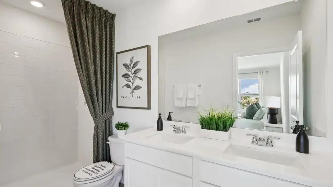 Furnished interior in a model home at Skyway Point in Tampa (Image 13).