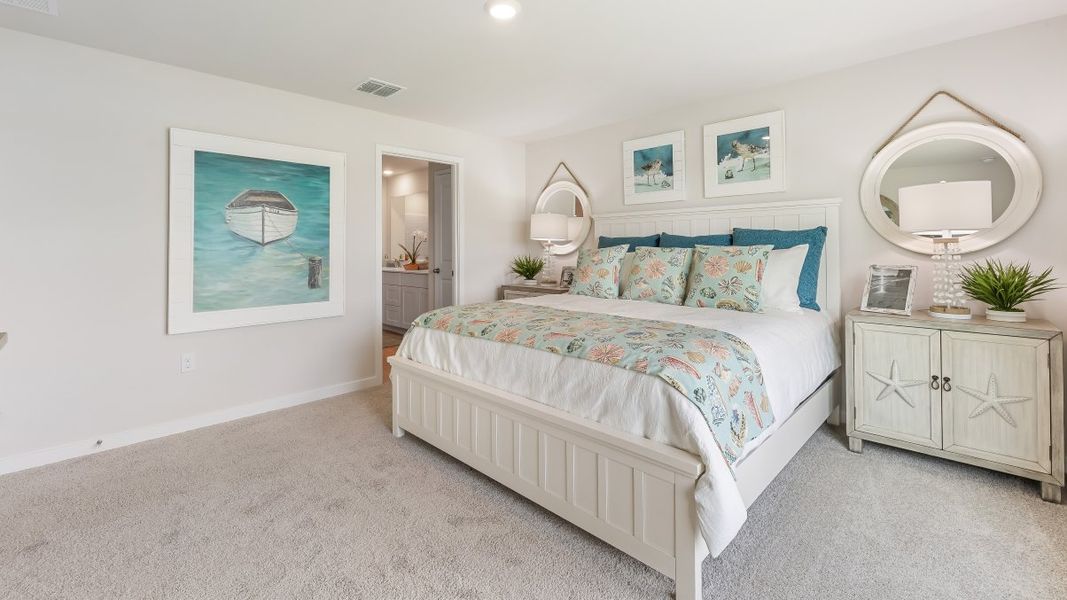 Furnished interior in a model home at Cali Cove in Punta Gorda (Image 21).