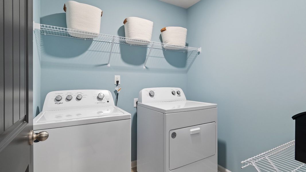 Upstairs laundry area with a shelf in new construction townhome at Avery Landing in McDonough, GA Upstairs laundry area with a shelf in new construction townhome at Avery Landing in McDonough, GA