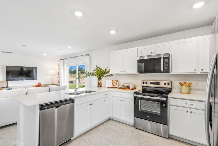 Furnished interior in a model home at Citrus Ridge in Lake Wales (Image 6).