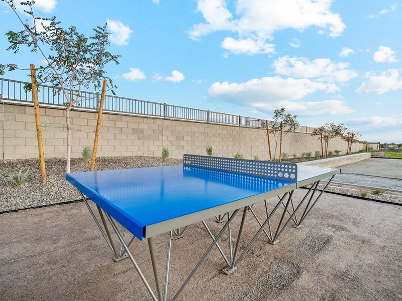 A table and chairs outside. A table and chairs outside.