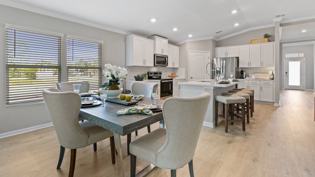 Furnished interior in a model home at American Village in Palm Coast (Image 7).