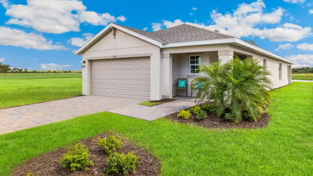 Front exterior of a home in the Coral Lakes - Tradition & Express community, located in Punta Gorda, FL (Image 10).