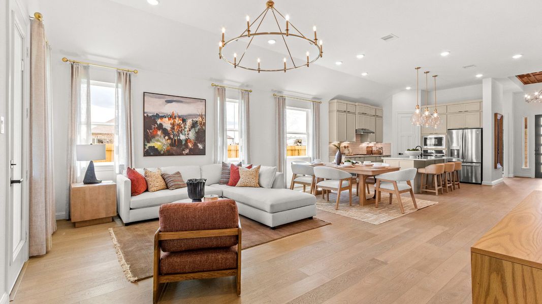 Beautiful open-concept kitchen, dining, and living area featuring connected everyday living spaces in Azalea community.