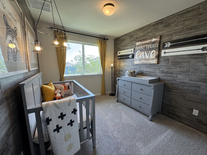 A cozy nursery with rustic wood accents, gray crib, and dresser, featuring playful artwork and warm lighting. A cozy nursery with rustic wood accents, gray crib, and dresser, featuring playful artwork and warm lighting.