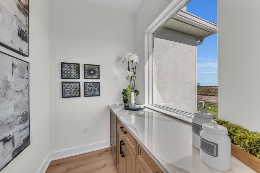 Furnished interior in a model home at Hampton Lakes in Sarasota (Image 157).