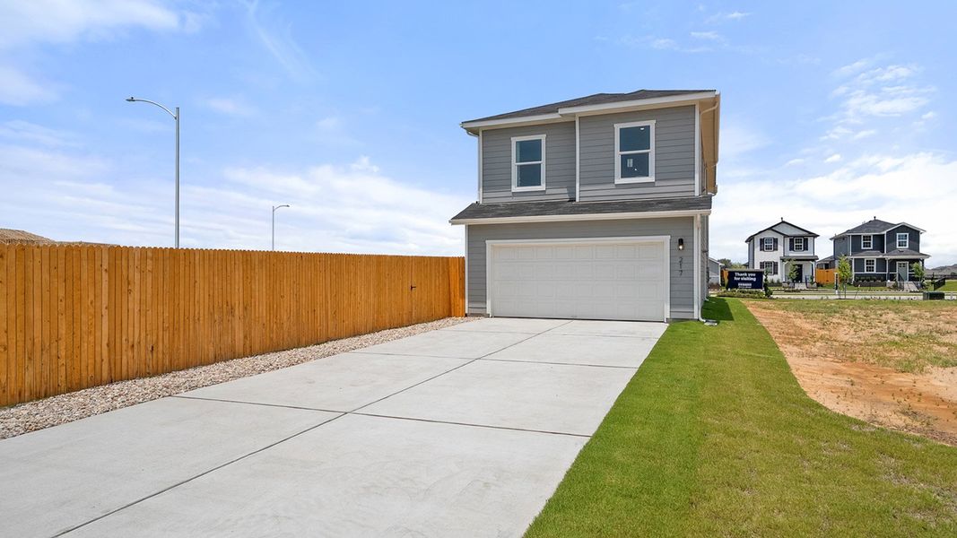 Front exterior of a home in the Valverde community, located in Bastrop, TX (Image 11). Front exterior of a home in the Valverde community, located in Bastrop, TX (Image 11).