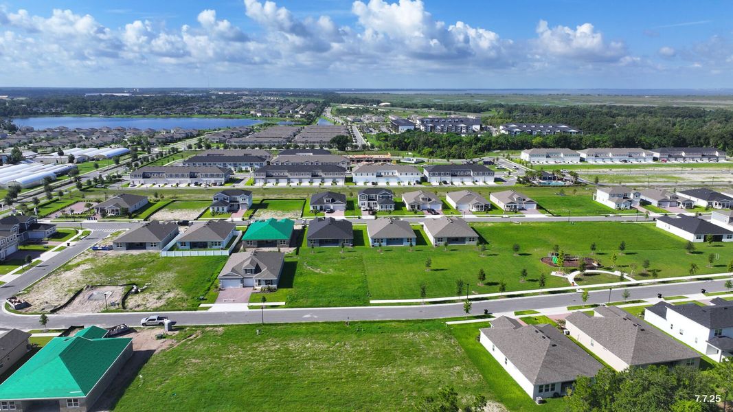 Aerial view of the Meadowlark Landing community in Apopka, FL, showing layout and nearby surroundings (Image 16).