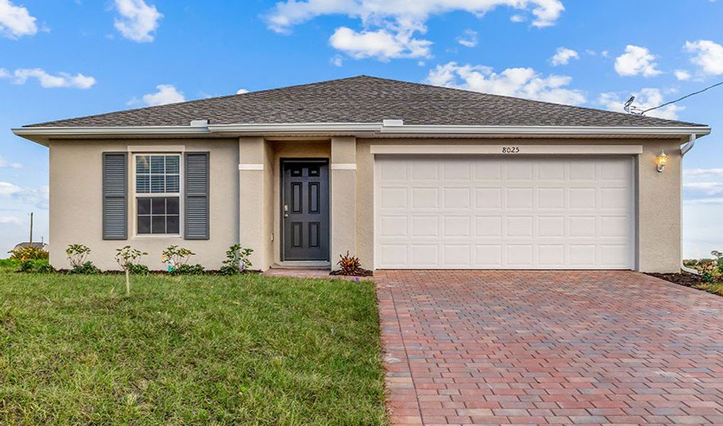 Front exterior of a home in the LaBelle Homes community, located in Lehigh Acres, FL (Image 1).