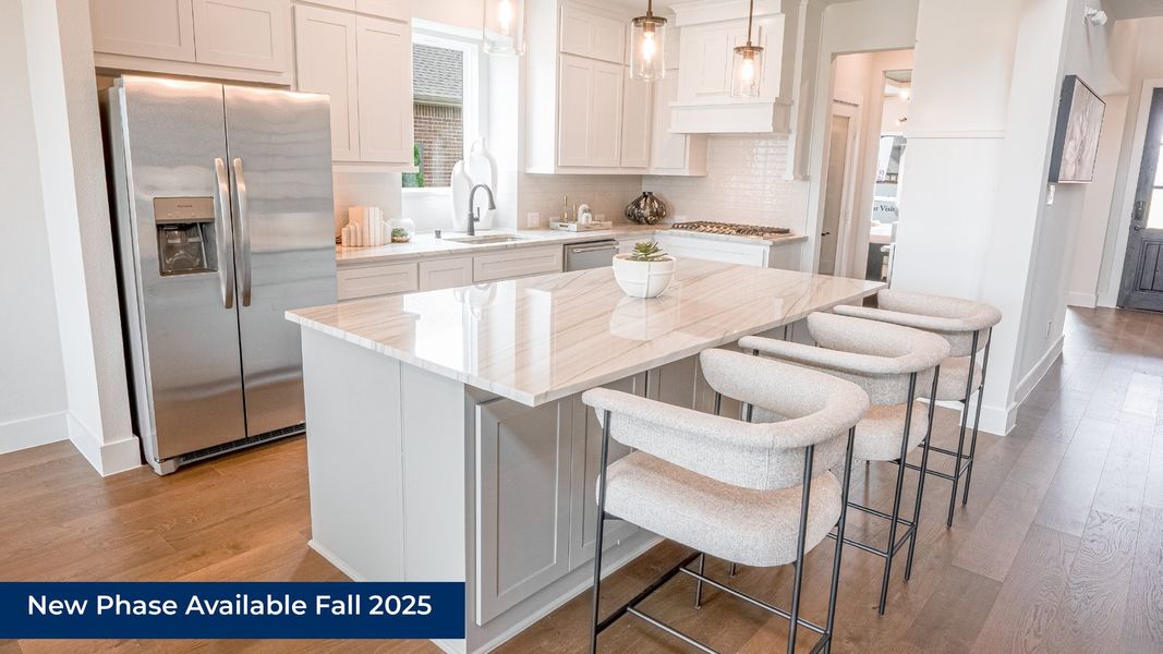 Furnished interior in a model home at Spiritas Ranch in Little Elm (Image 3).