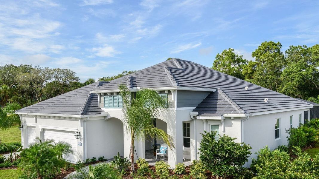 Front exterior of a home in the Grand Palm Real Estate and Homes for Sale in Venice, FL - Neal Communities community, located in Venice, FL (Image 5). Front exterior of a home in the Grand Palm Real Estate and Homes for Sale in Venice, FL - Neal Communities community, located in Venice, FL (Image 5).