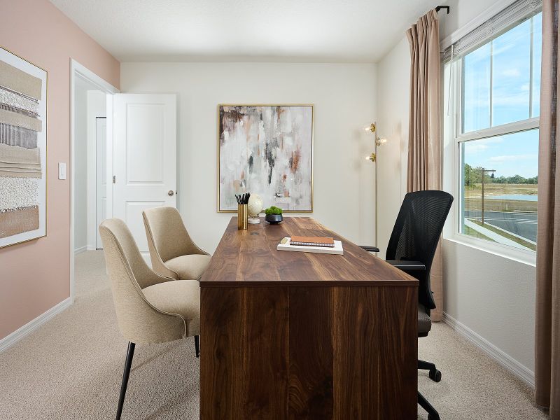 Furnished interior in a model home at Oakfield Trails - Classic Series in Parrish (Image 10).