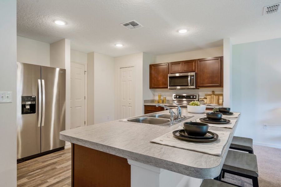 Furnished interior in a model home at Poinciana in Poinciana (Image 9).