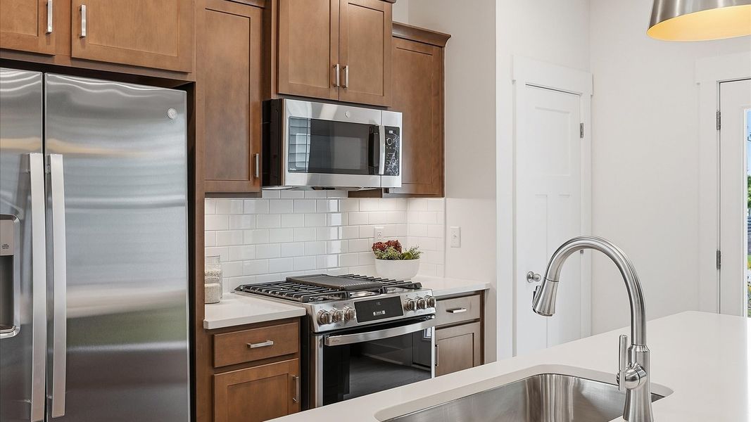 Well-designed kitchen with a center island and tasteful finishes that elevate everyday living in Simpsonville, SC Well-designed kitchen with a center island and tasteful finishes that elevate everyday living in Simpsonville, SC