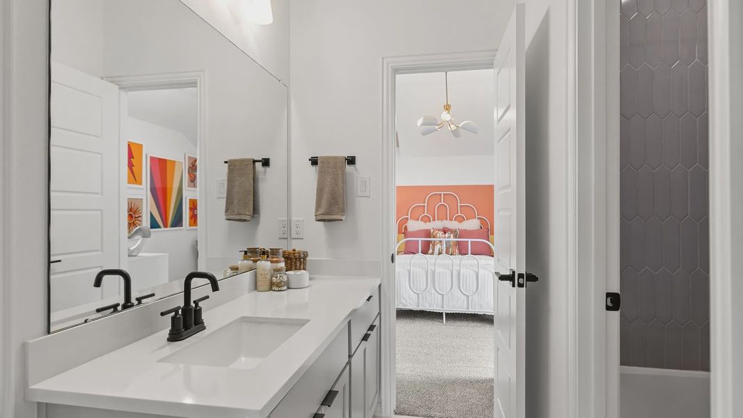 Elegant bathroom boasts sleek black fixtures, hexagonal tiles. Beamer Villas offers refined living. Elegant bathroom boasts sleek black fixtures, hexagonal tiles. Beamer Villas offers refined living.