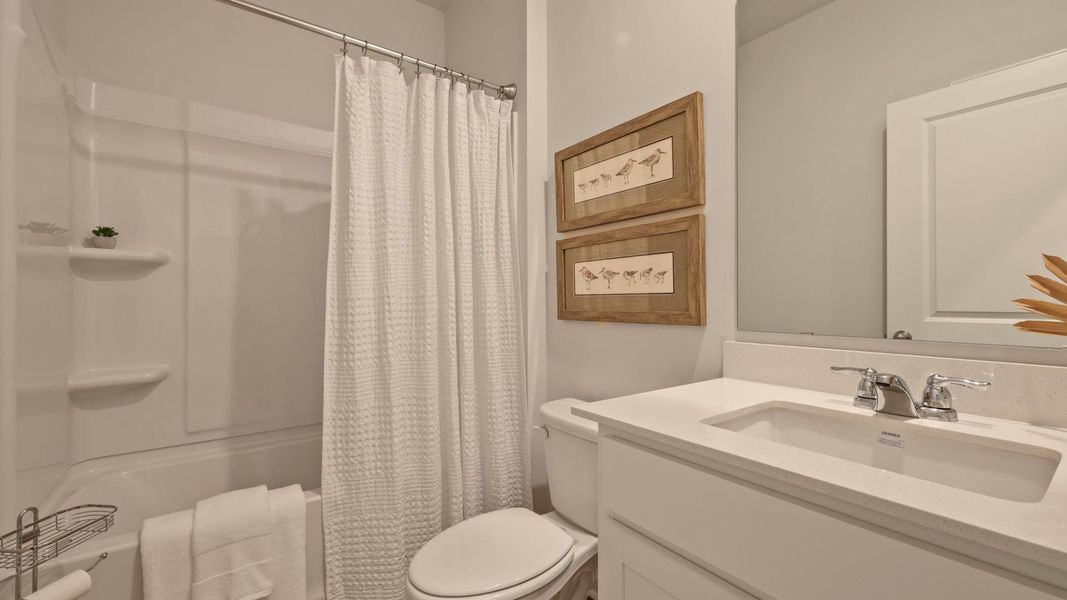 Furnished interior in a model home at Pineview North in Summerville (Image 17).