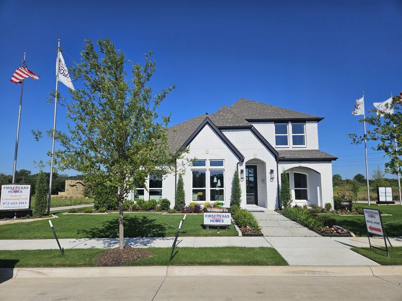 A stunning white brick home with a landscaped yard at Trails at Cottonwood Creek by First Texas Homes (Rowlett, TX). A stunning white brick home with a landscaped yard at Trails at Cottonwood Creek by First Texas Homes (Rowlett, TX).