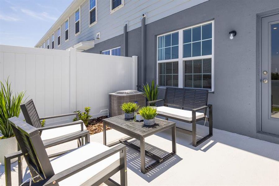 Unwind on your patio—perfect for relaxing, laughing, and connecting with friends.