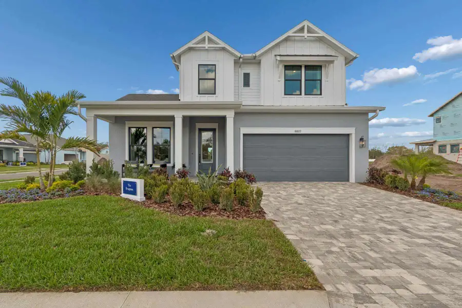 Front exterior of a home in the Lakeview Crossing – Tradition Series community, located in Sarasota, FL (Image 3).