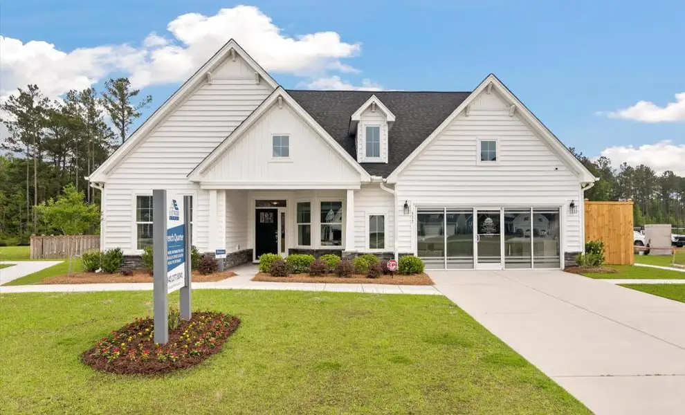 Front exterior of a home in the The Enclave at French Quarter Creek community, located in Huger, SC (Image 1).