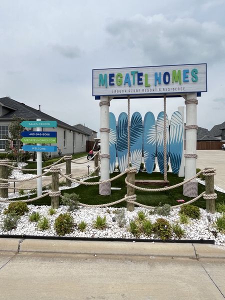Beautiful entrance to Venetian by Megatel Homes, featuring nautical-themed decor and lush landscaping in Celina, TX.